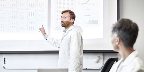 Scientist giving presentation on lab results