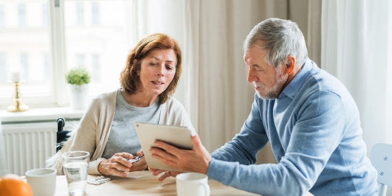 Couple looking at trial procedure on tablet