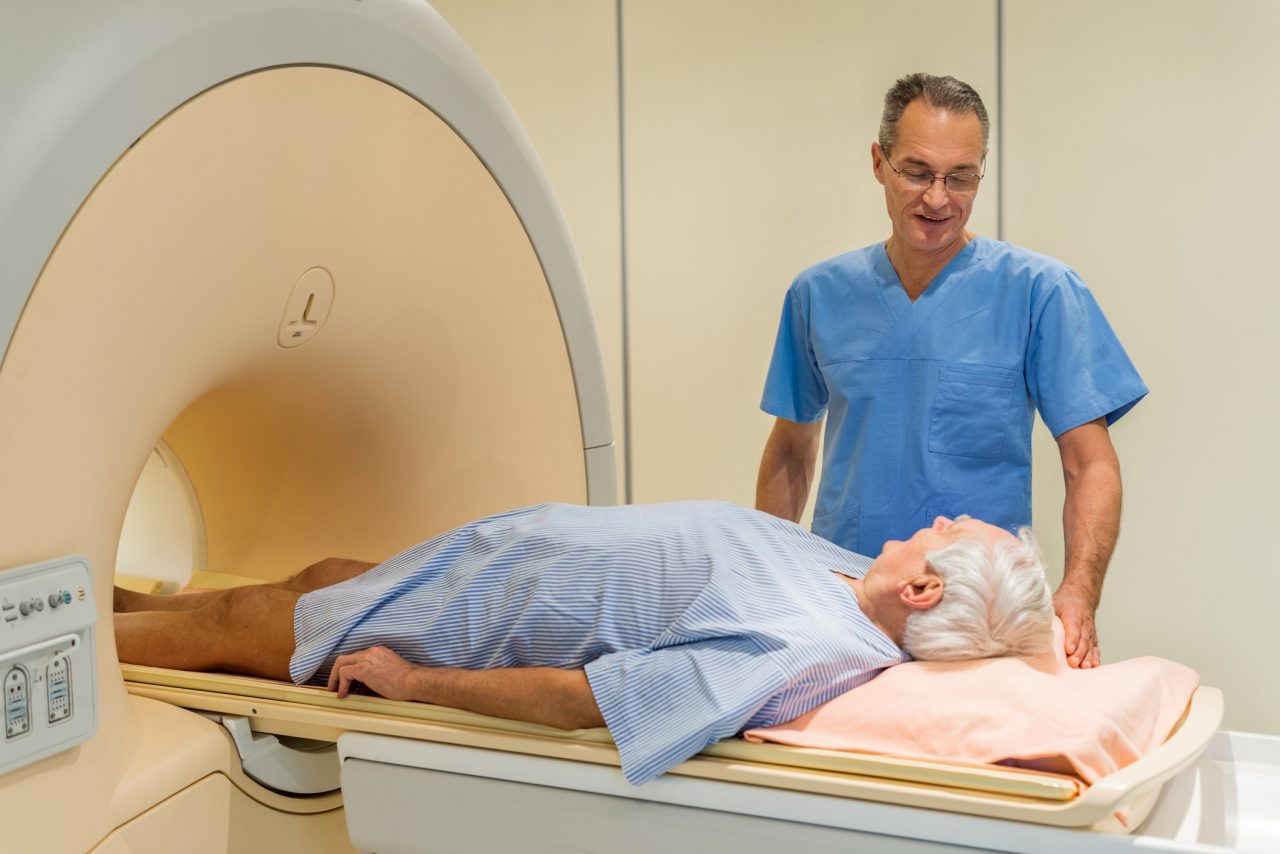 Radiologist talking to a senior patient at MRI scan