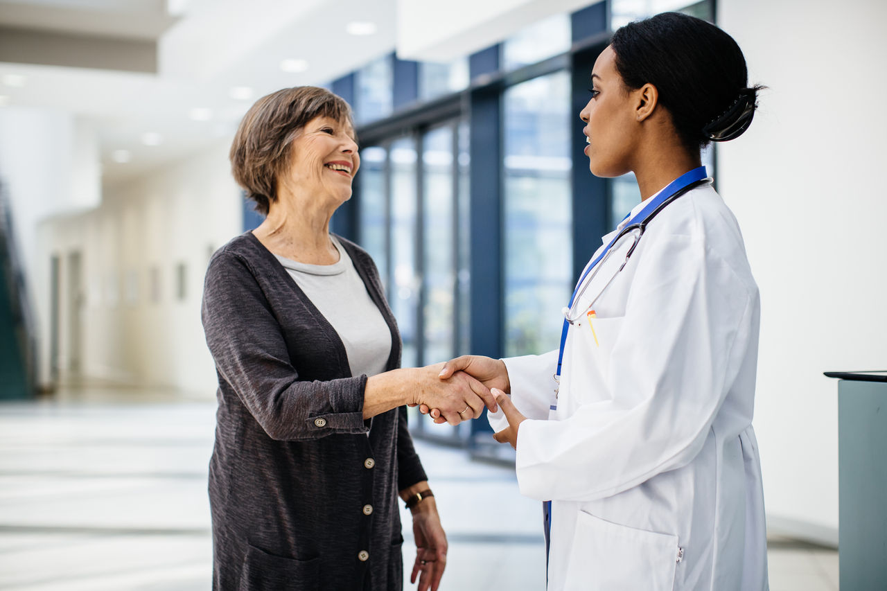 Doctor greeting patient for appointment