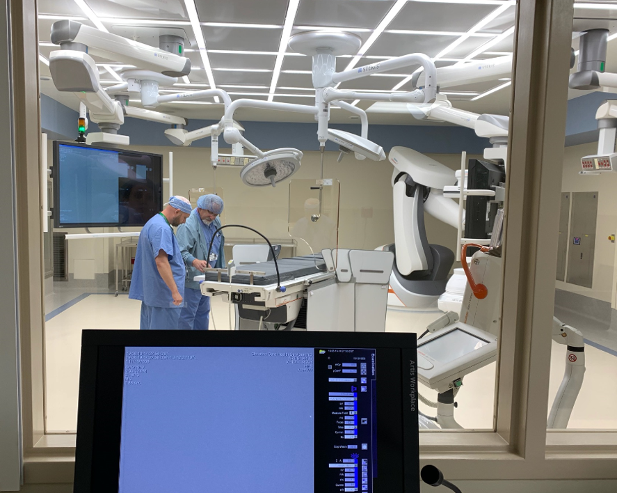 Providers in a structural heart lab with high tech equipment