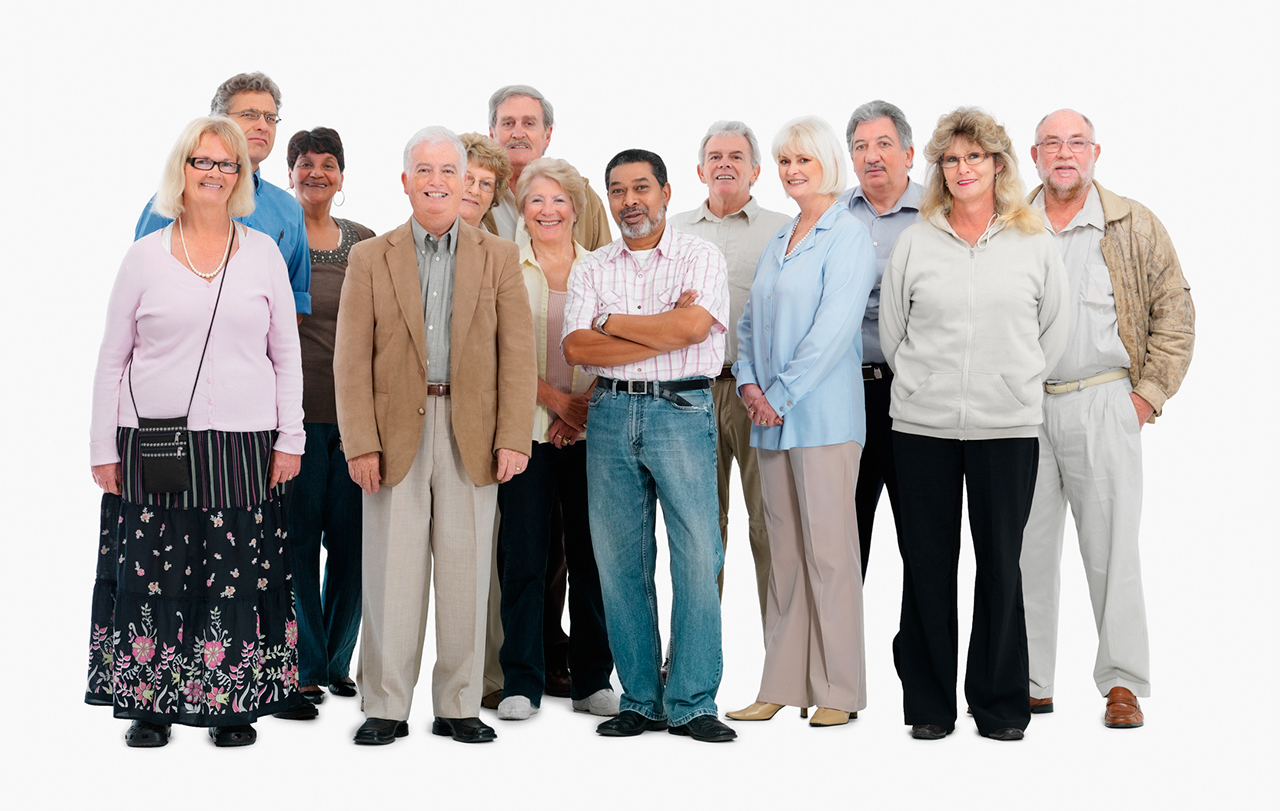 A group of mostly older people smiling for the picture.