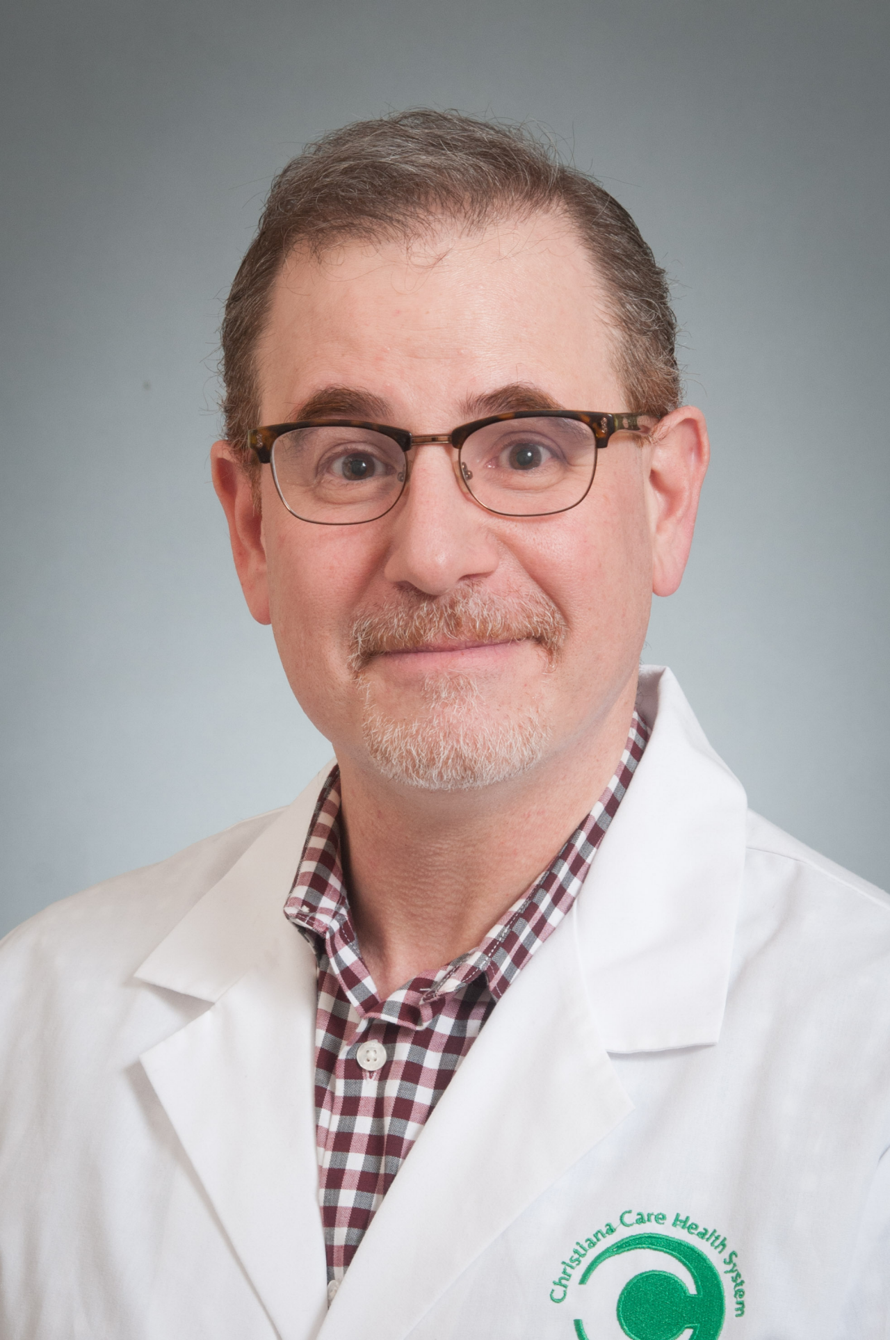 Doctor with glasses in white lab coat
