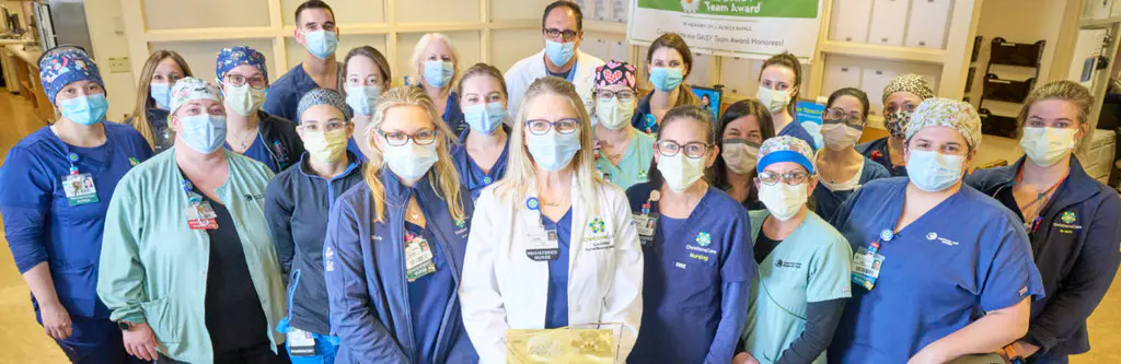 ChristianaCare's Medical Intensive Care Unit poses with their Beacon Award