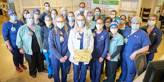 ChristianaCare's Medical Intensive Care Unit poses with their Beacon Award