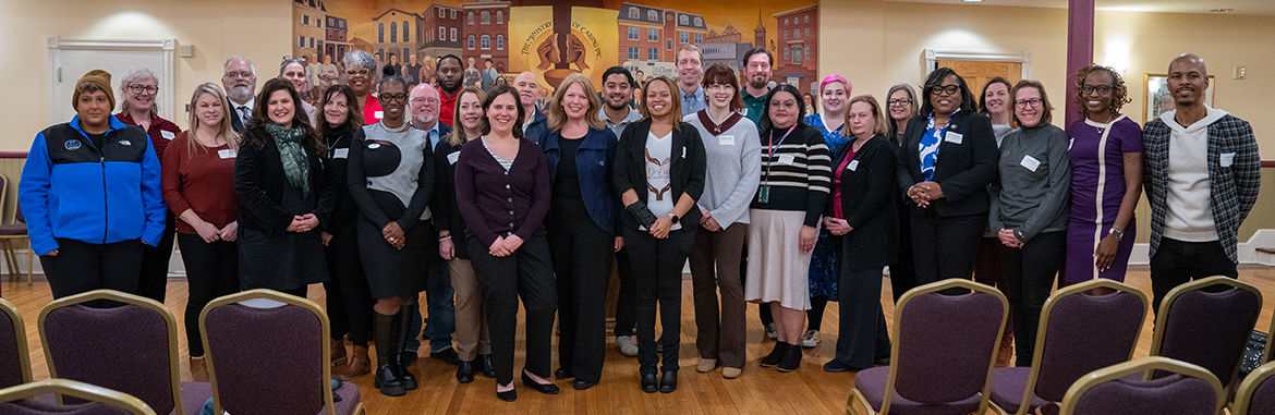 Group photo in a community hall setting