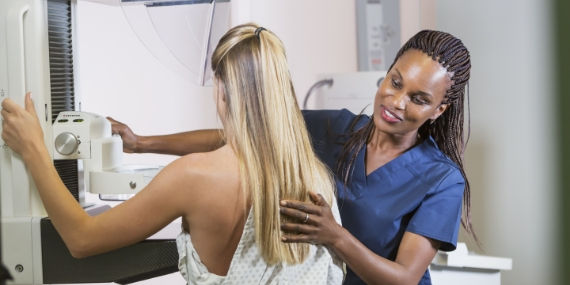 Patient in breast scanning machine