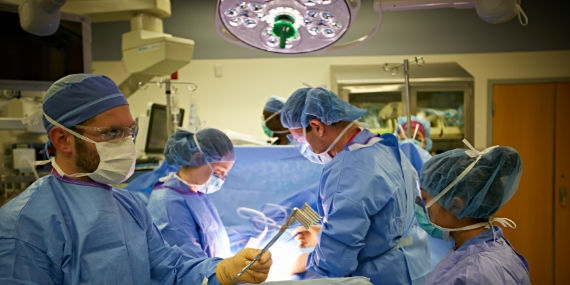 Group of surgeons in the operating theatre 