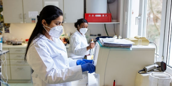 Scientist in lab testing blood samples