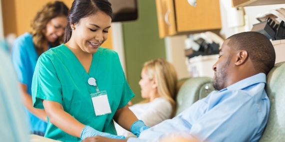 Hospital phlebotomist taking a sample from a patient
