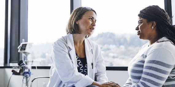 Female patient talking to doctor about surgery