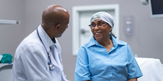 Doctor with cancer patient