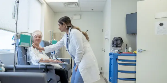 Doctor checking patients chemotherapy dosage