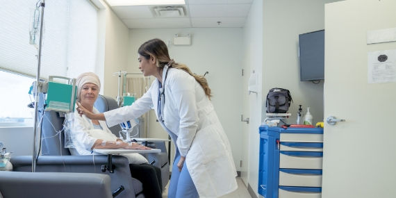 Doctor checking patients chemotherapy dosage