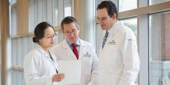 Team of ChristianaCare doctors in a hospital hallway
