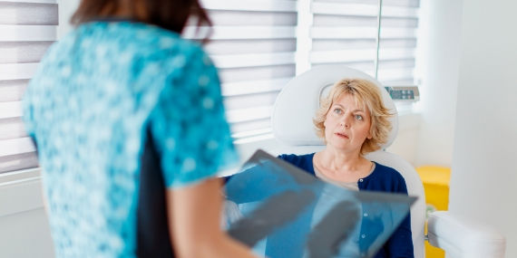Doctor looking at scans of patients lungs