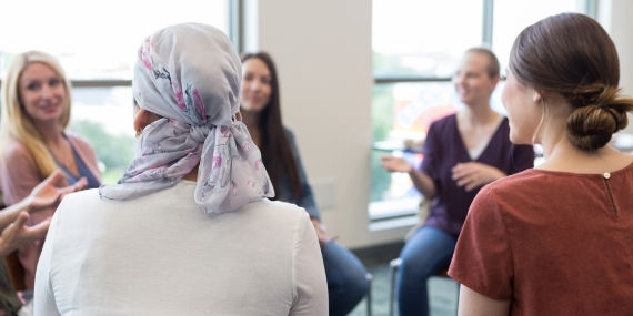 Women in circle discussing cancer treatment