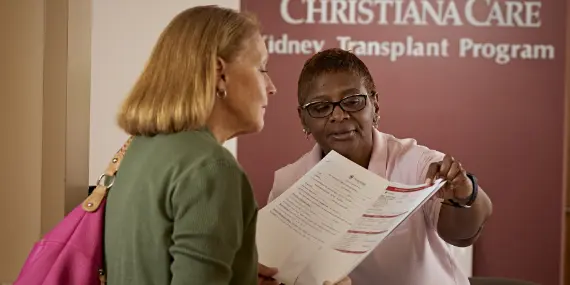 Prospective patient at kidney transplant reception desk 