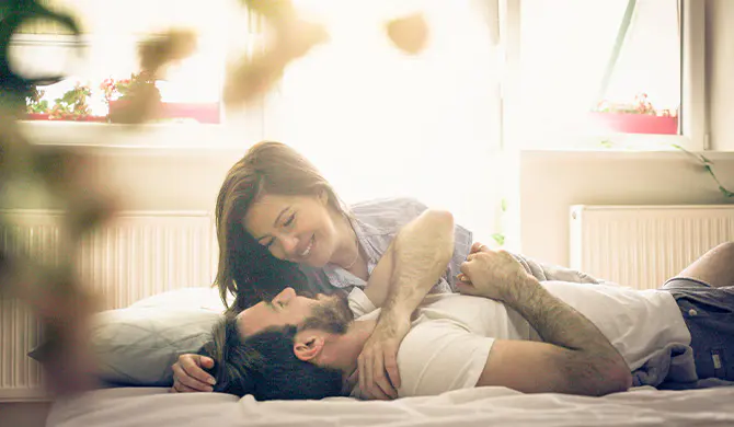 Couple together in bedroom