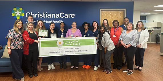 Nurses at the ChristianaCare Center for Virtual Health gather for a picture for the Daisy Award