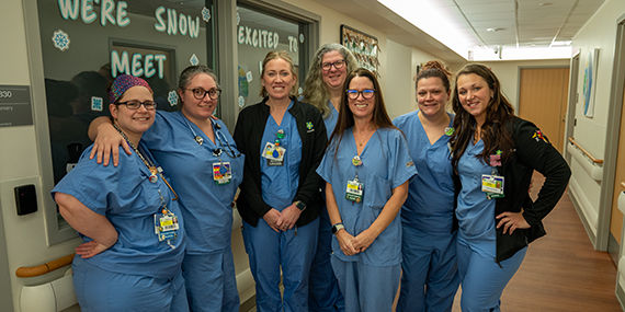 A group of nurses at Union Hospital gather and small for the camera