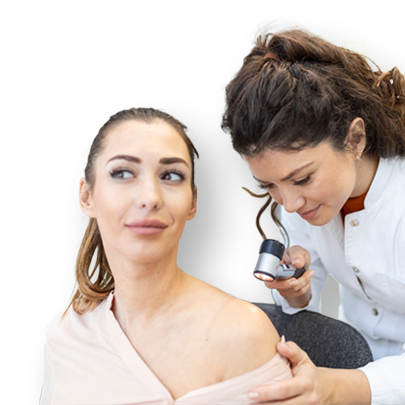 A medical professional examines the skin on a woman's shoulder