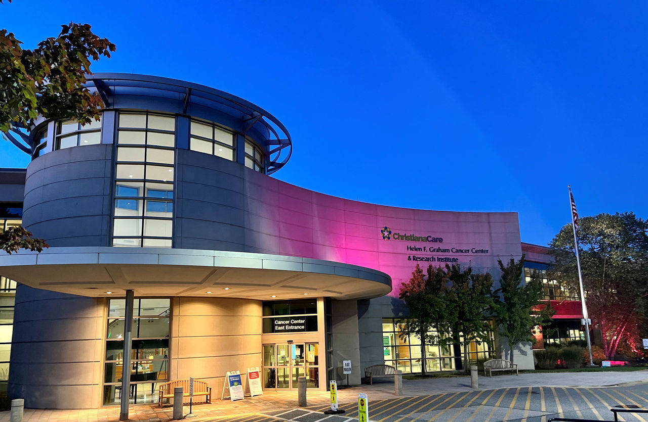 An external evening view of the Helen F. Graham Cancer Center & Research Institute