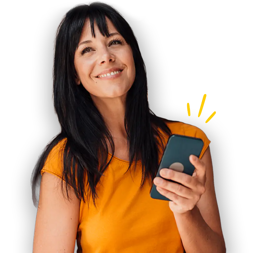 Woman looks up to the sky smiling while holding a smart phone