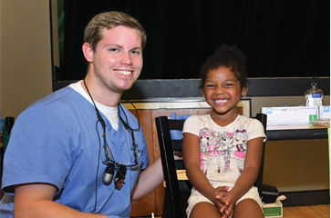 Doctor and young child smiling