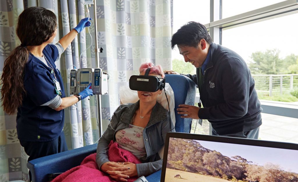 Patient in virtual reality headset in hospital bed