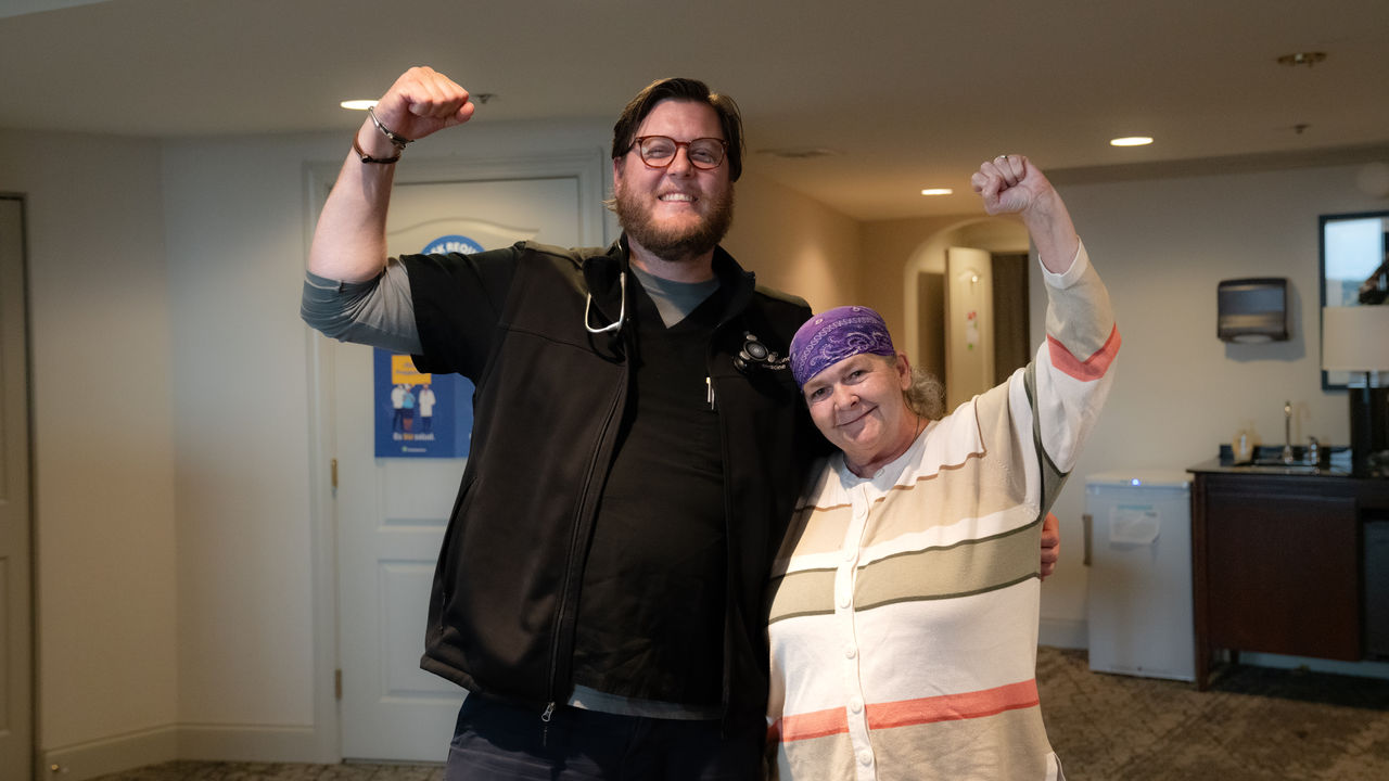 Community health doctor and patient cheering together