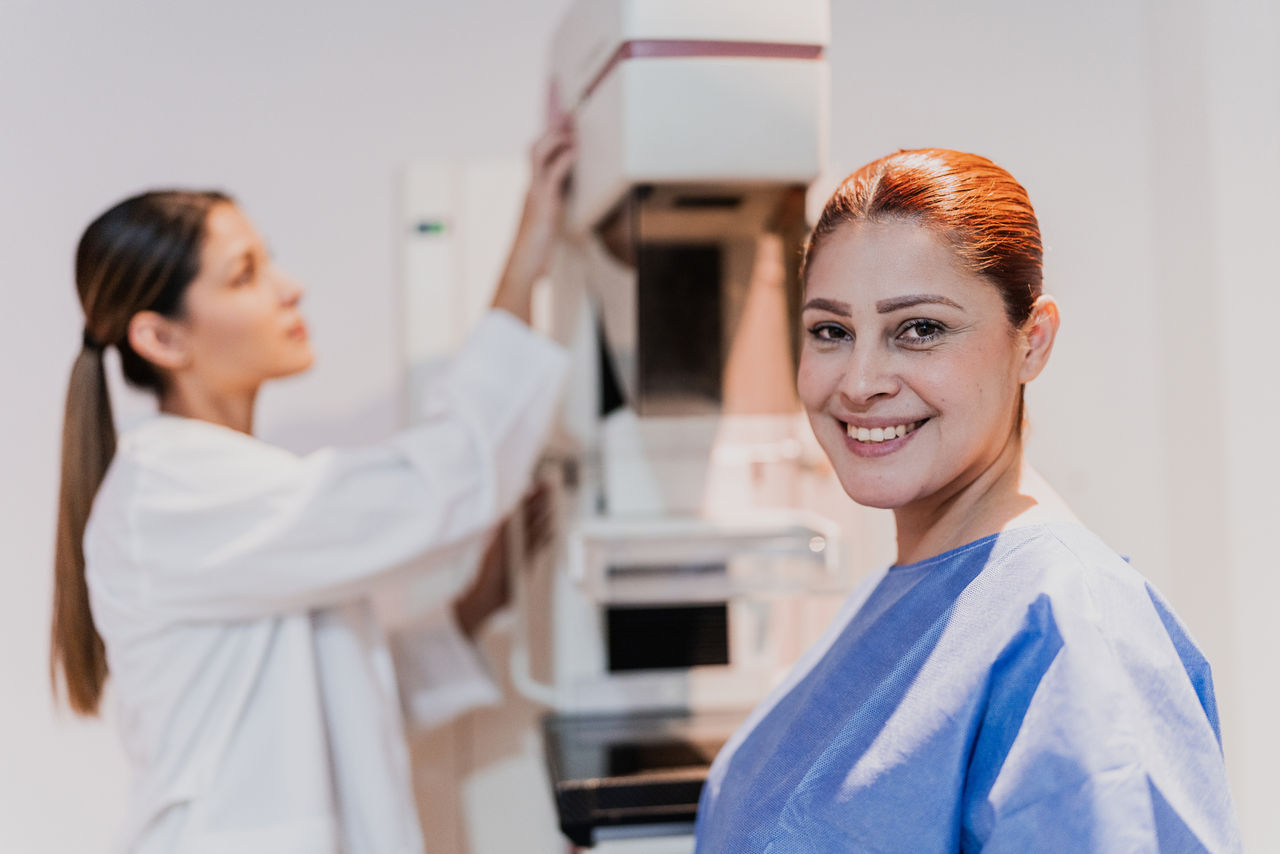 Portrait of a mid adult woman in mammography room at hospital