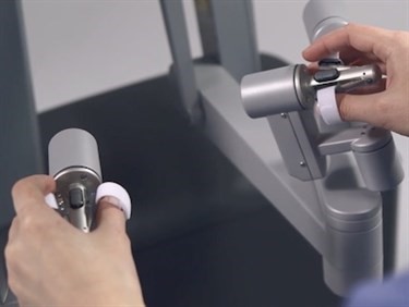The surgeon controls robotic instruments