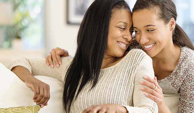 Two people smiling and caring