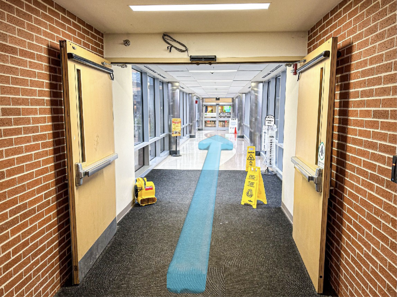 Step 5: Walk across the covered bridge to the hospital’s main entrance.