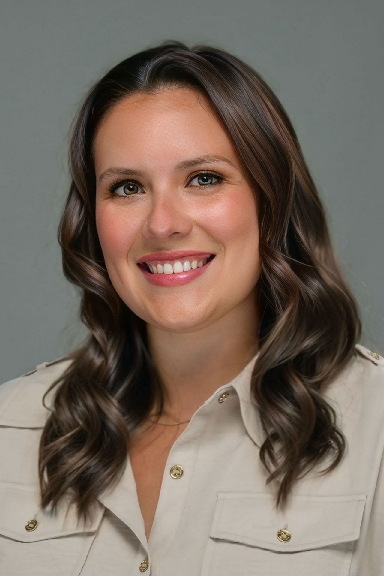 A headshot portrait of Rebecca Divalerio