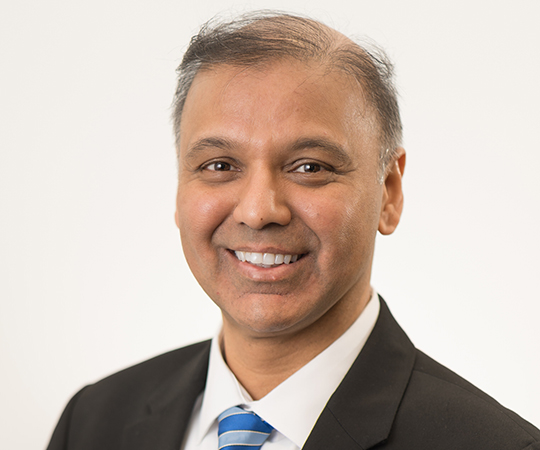 Doctor with glasses in white lab coat