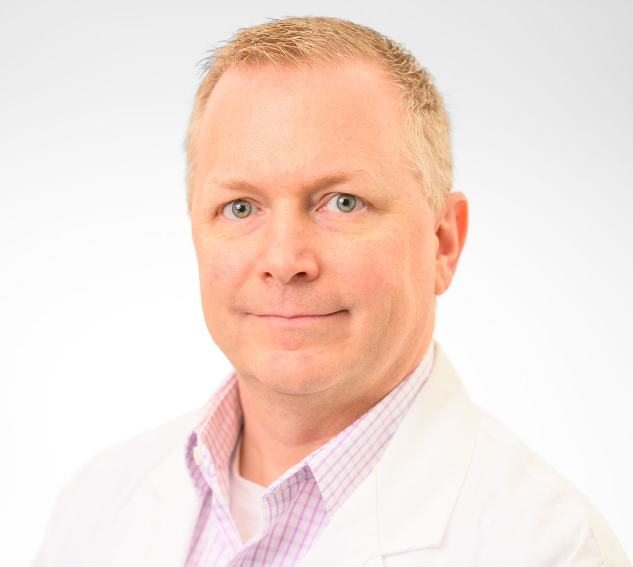 Doctor with glasses in white lab coat