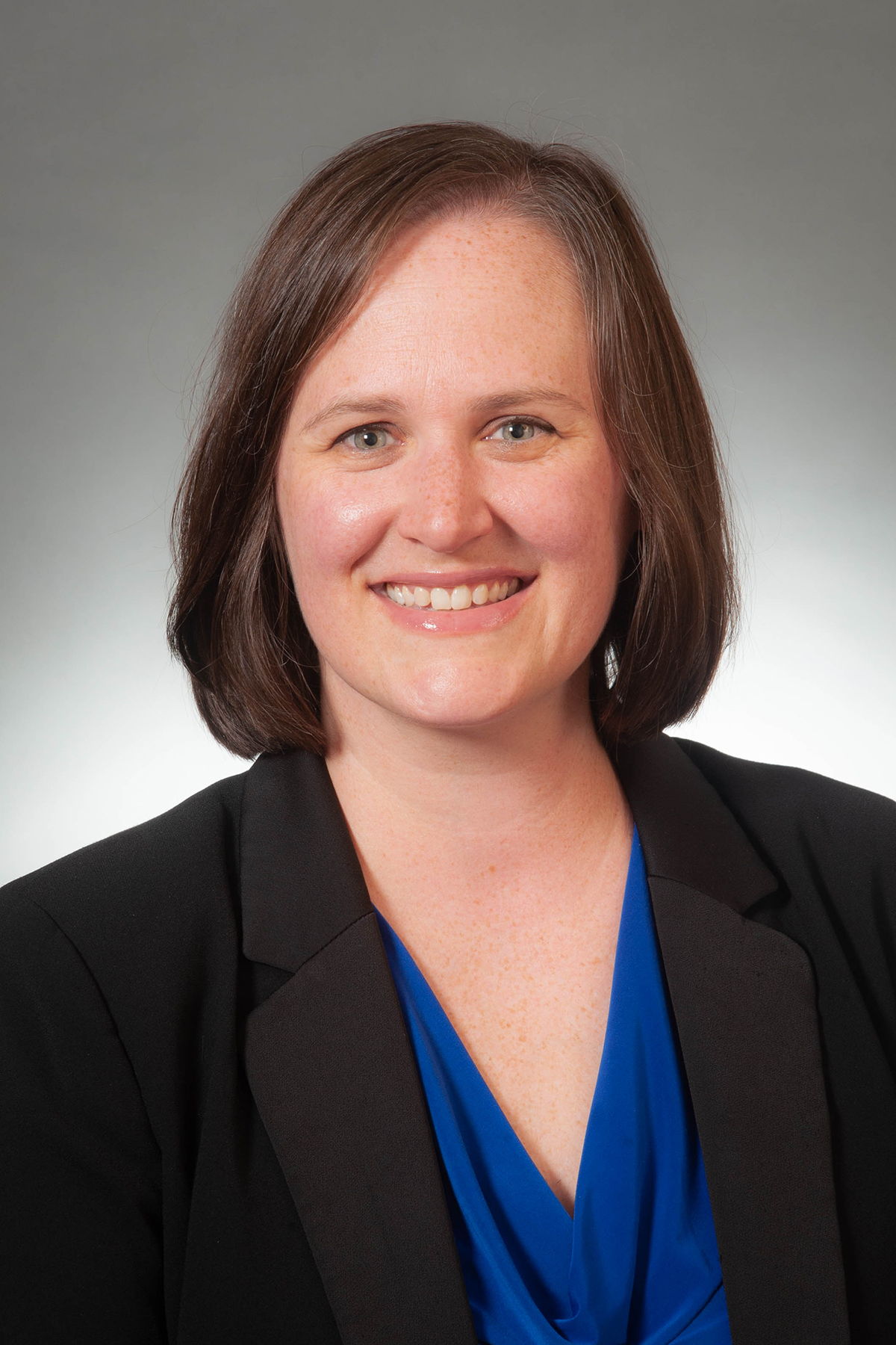 Smiling woman in lab coat