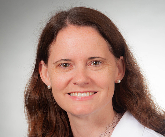 Doctor with glasses in white lab coat