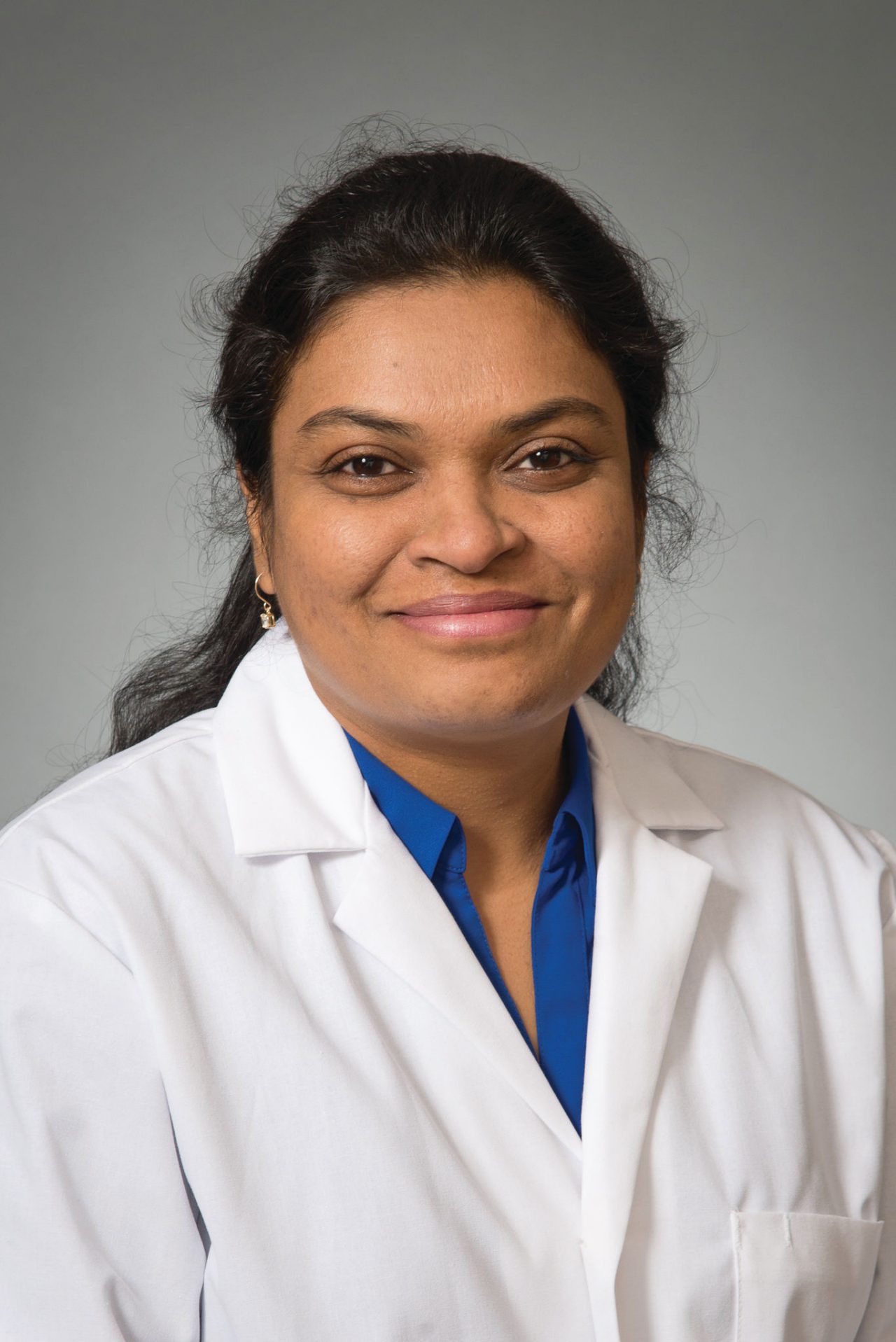 Doctor with glasses in white lab coat