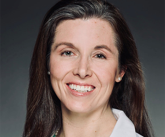 Doctor with glasses in white lab coat