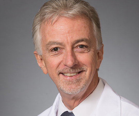 Doctor with glasses in white lab coat