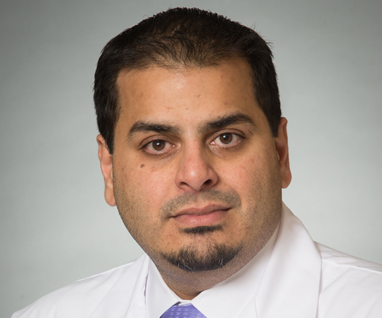 Doctor with glasses in white lab coat