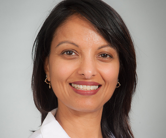 Doctor with glasses in white lab coat
