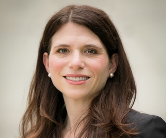 Smiling woman in green jacket