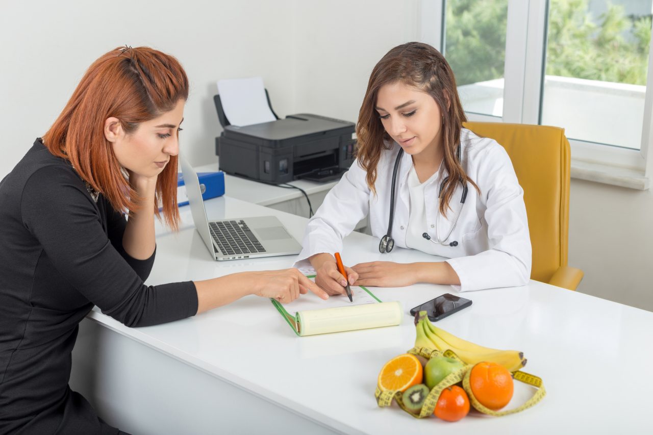 Nutritionist showing diet plan