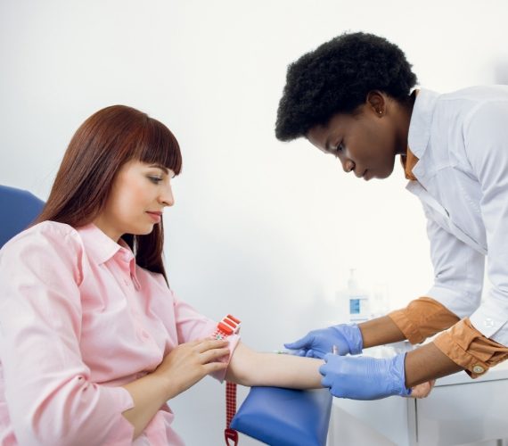 Doctor ready to take blood sample from patient's vein