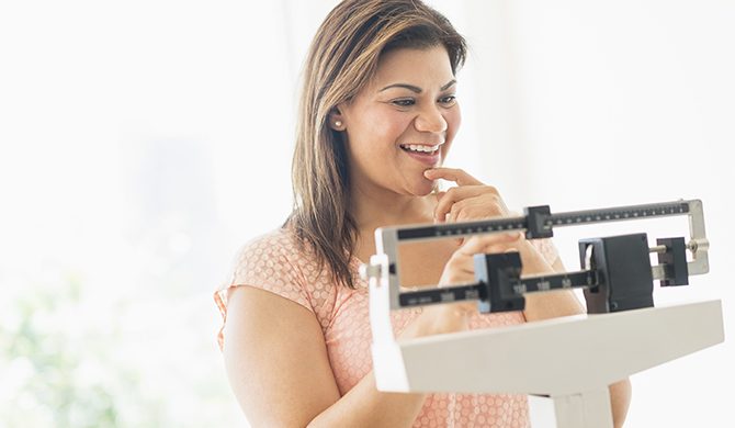 Lady weighing herself